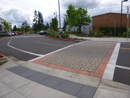 Brick crosswalk from Tualatin Public Library to Tualatin River Greenway Trail – tactile strip